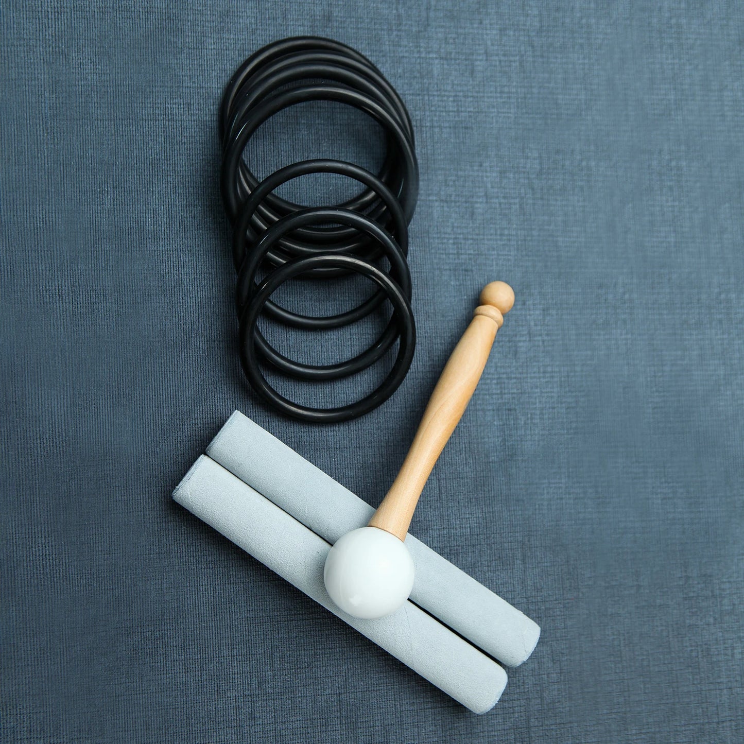Rubber holders and rods for crystal singing bowls